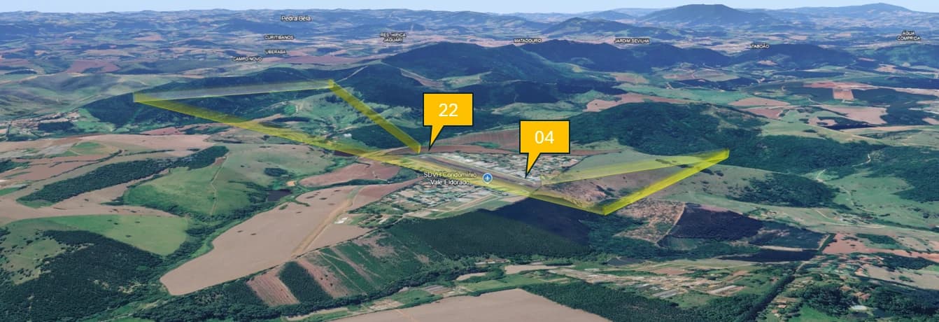Vista 3D do Vale Eldorado com os corredores de aproximação e saída das cabeceiras 22 (a noroeste) e 04 (a sudeste) desenhados em amarelo sobre o terreno